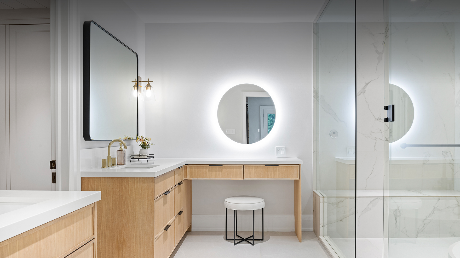 Stavebank Road bathroom vanity with an illuminated round mirror and oak cabinetry
