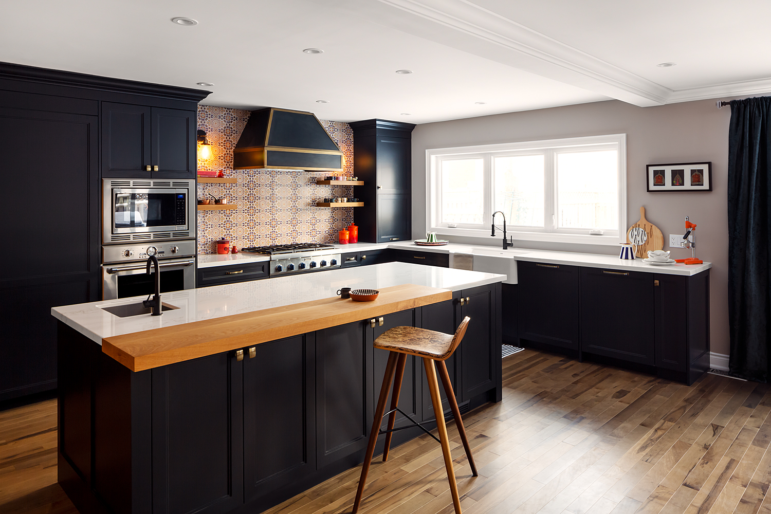 Marmac Crescent kitchen with dark cabinetry and a butcher-block island