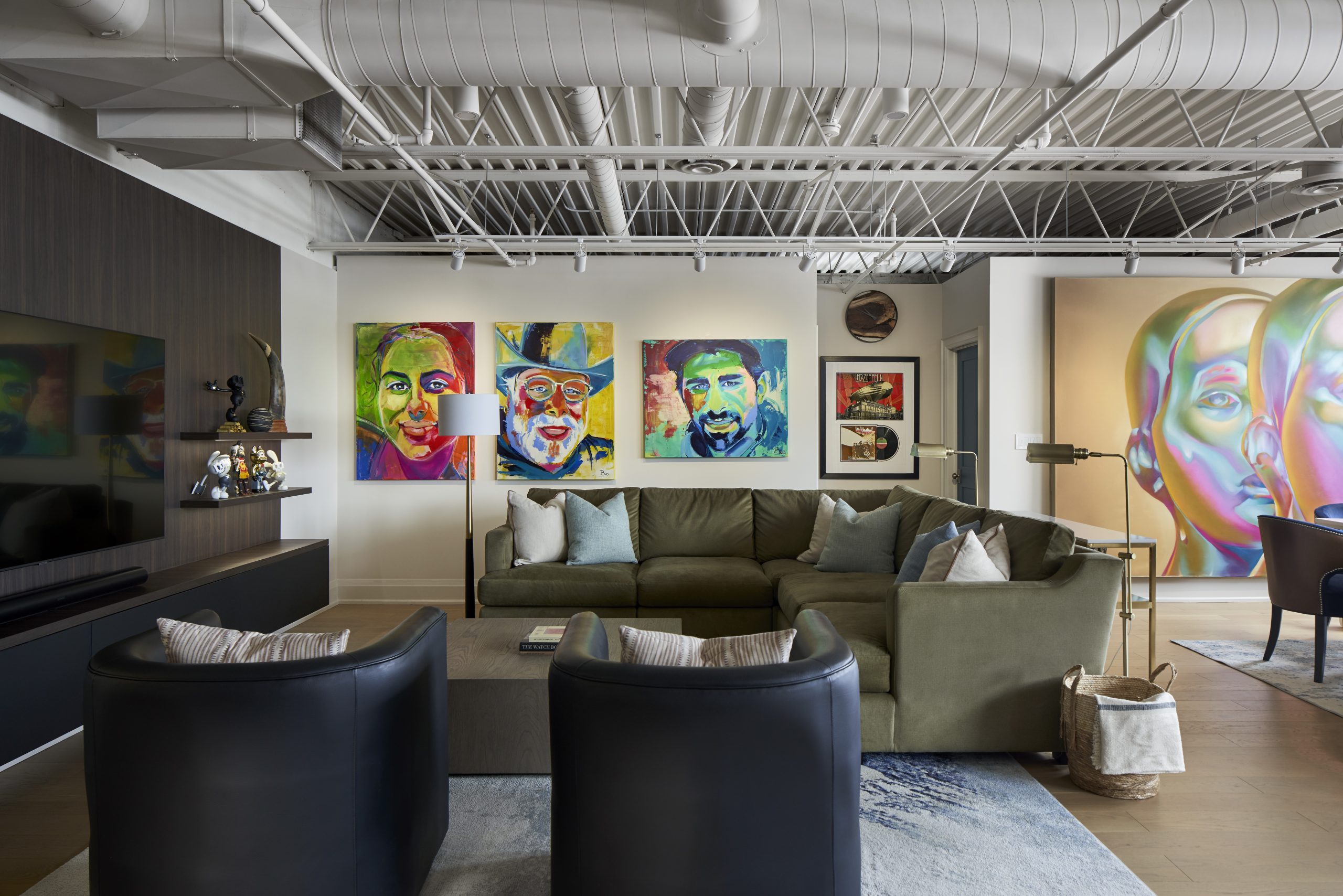 Signet Drive lounge with pop-art portraits and low leather armchairs
